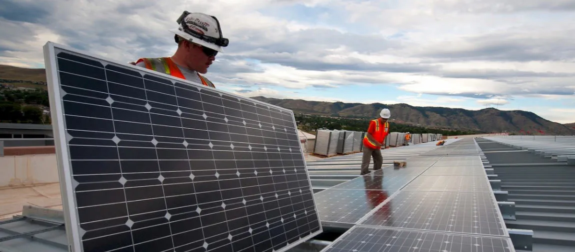 men installing solar panels